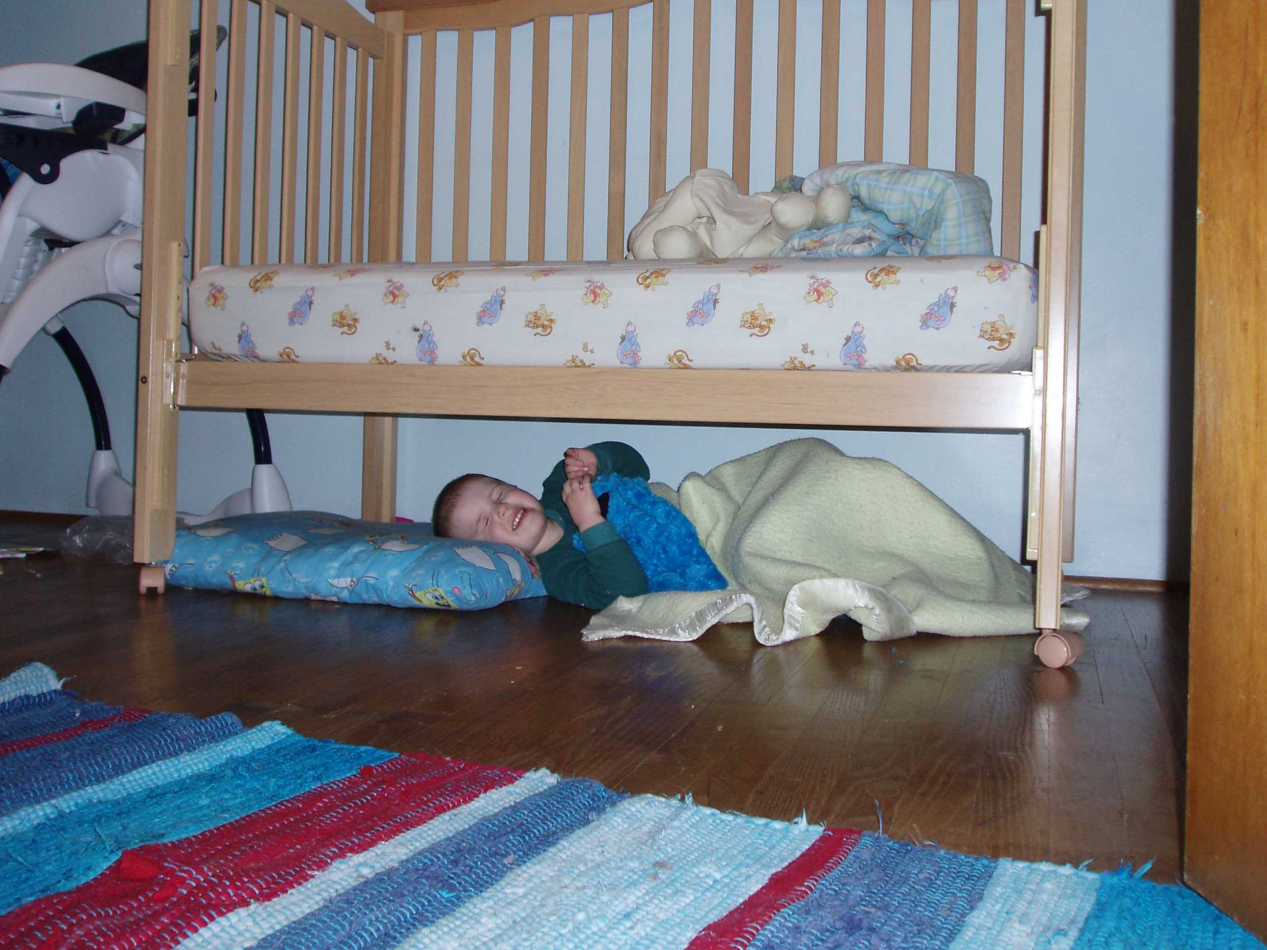sleepingunderbed.jpg